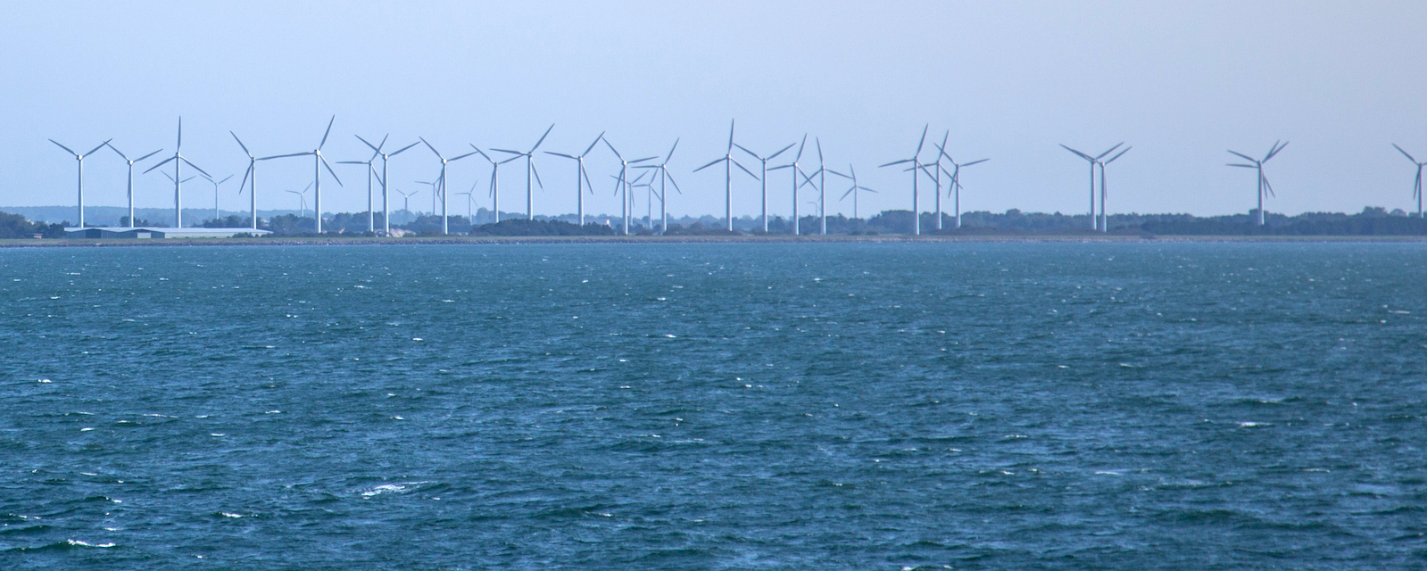 Windmills along a coast Windmills along a coast